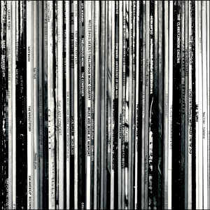 stack of vinyl records on a shelf